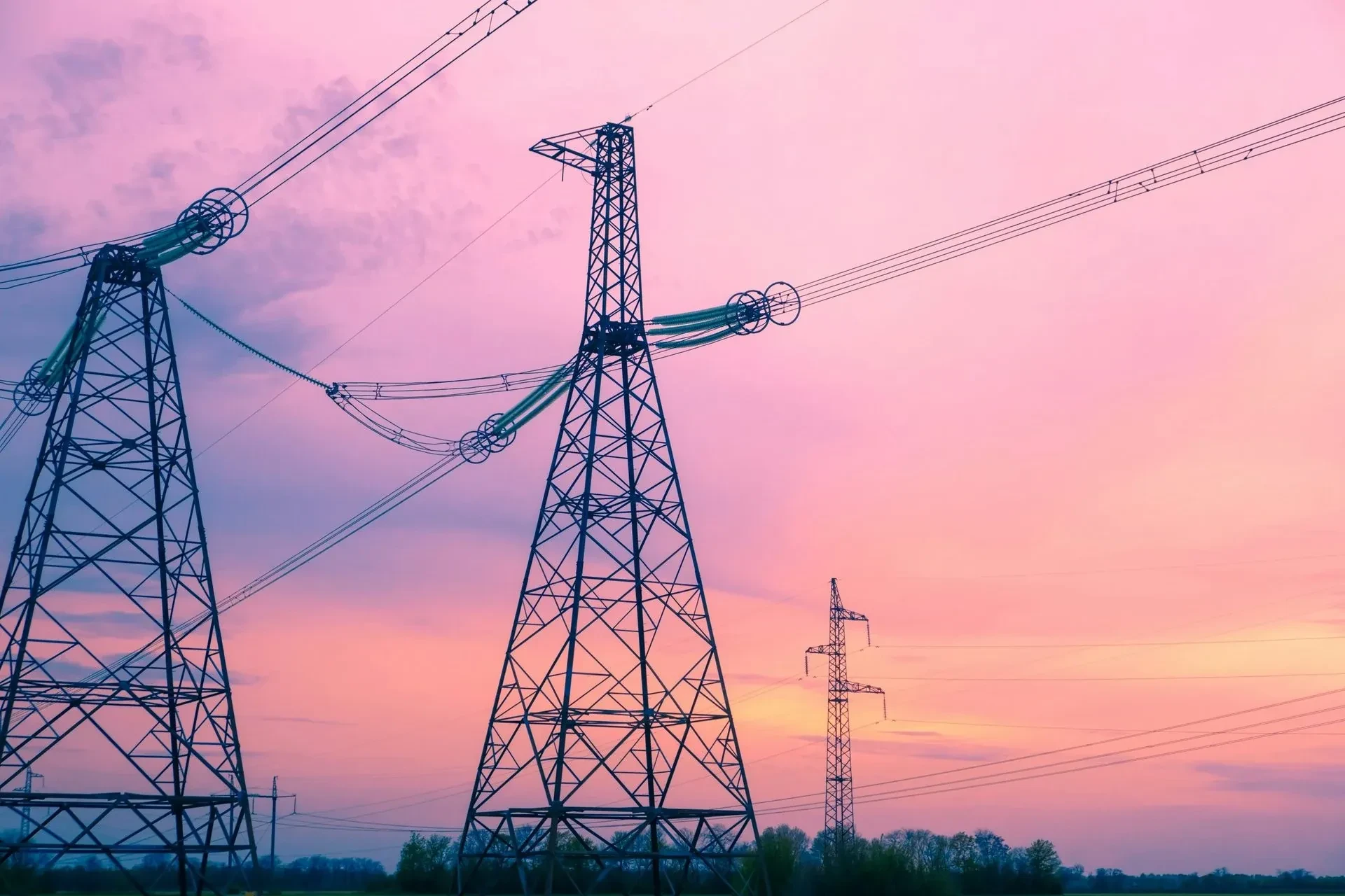 Transmission towers at sunset